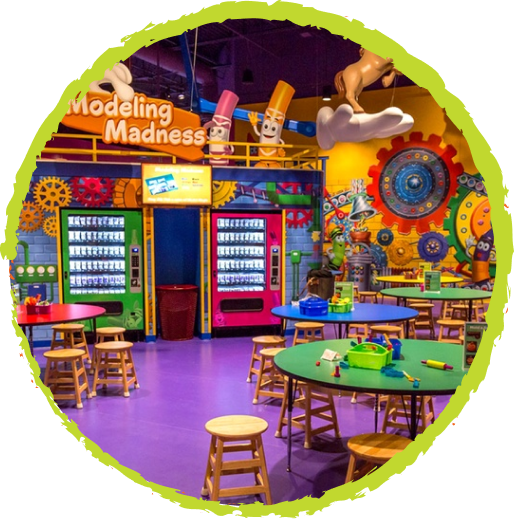 Tables and stools inside the Crayola Modeling madness attraction